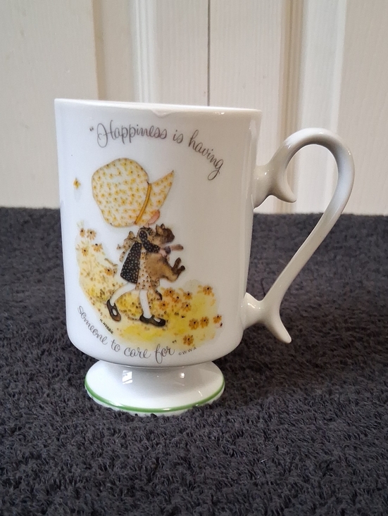 Holly Hobbie Other - Holly Hobbie Ceramic Pedestal Mug Yellow Floral "Happiness Is Having Someone..."